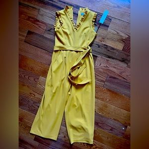 Calvin Klein cropped yellow jump suit with a pretty neck and shoulder detail